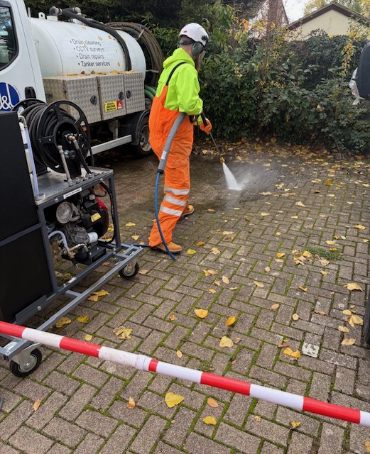 Instructor delivering on-site water jetting training